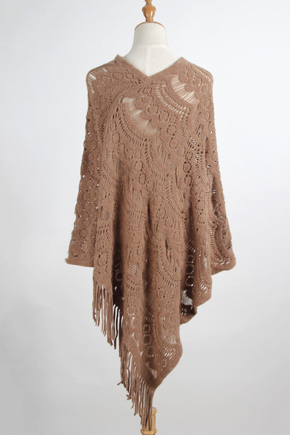 Camel crochet poncho with intricate lace pattern and fringe details