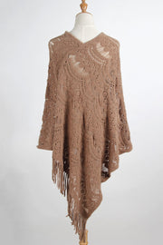Camel crochet poncho with intricate lace pattern and fringe details