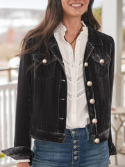 Black velvet western jacket with silver buttons and chest pockets.