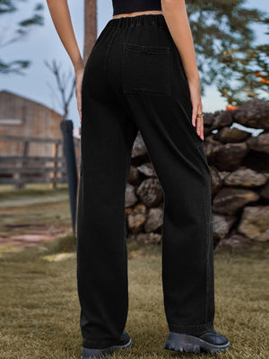 Black denim cargo pants with elastic waist and back pocket detail.