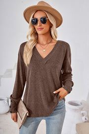 Button-cuff slouch v-neck top in mocha with long sleeves and a relaxed fit.