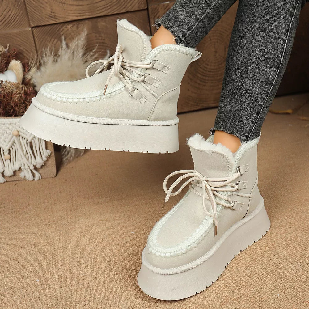 Suede lace-up platform ankle boots with faux fur trim and chunky sole.