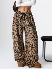 Leopard print lounge palazzo trousers with a black bow detail and wide leg.