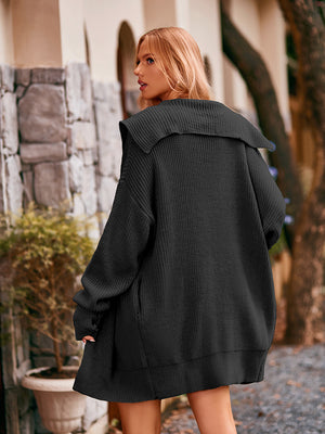 Black knit cocoon cardigan with oversized collar and ribbed details.