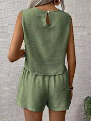 Green textured two-piece set with V-notch top and elastic waist shorts.