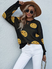 Black smiley face jacquard knit sweater with crew neck and long sleeves.