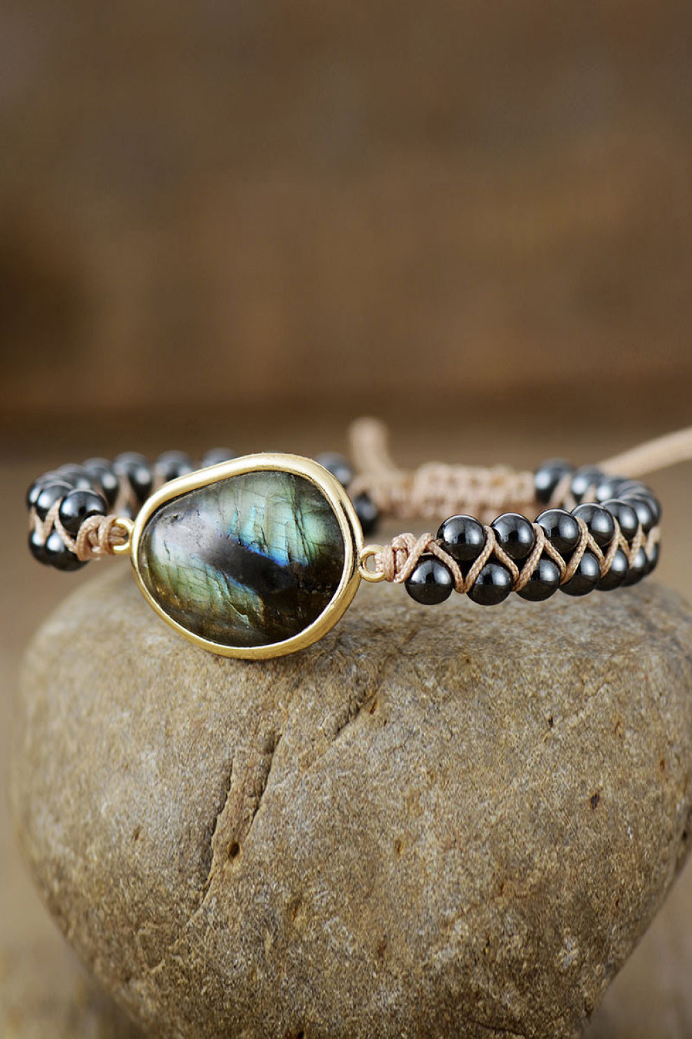 Black beaded bracelet with labradorite stone and braided detail