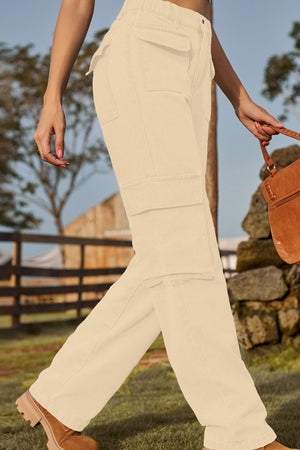 Utility pocket denim cargo pants in tan with multiple pockets and a relaxed fit.