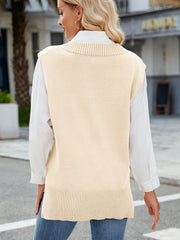 Cream ribbed knit V-neck sweater vest with a relaxed fit, styled over a white collared shirt.