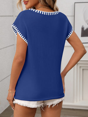 Royal blue knit V-neck sweater top with white contrast trim on neckline and sleeves.