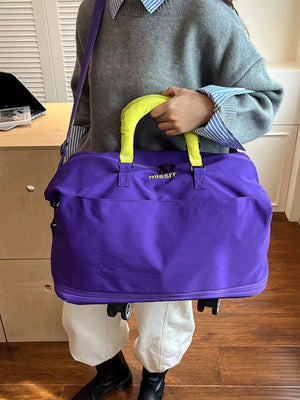 Vibrant purple travel bag with neon yellow handles and a crossbody strap.