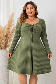 Matcha green ribbed fit-and-flare midi dress with tie-front neckline and long sleeves