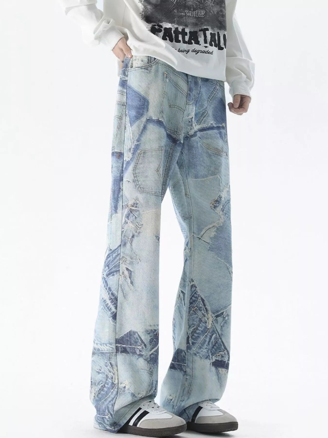 Light blue distressed wide-leg denim jeans with patchwork details and ripped accents.