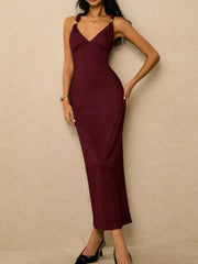 Burgundy ribbed midi dress with V-neck and gold-tone strap details.