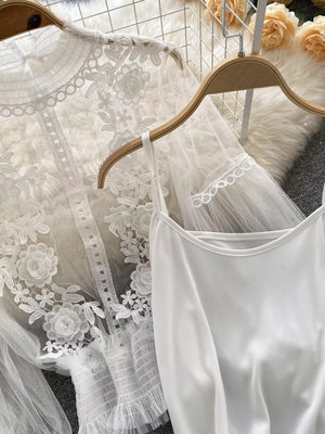 White lace embroidered blouse and cami set with floral details and sheer sleeves.