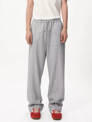 Gray cotton sweatpants with drawstring waist and wide legs.
