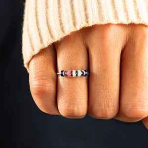 Sterling ring with colorful beads in pink, light blue, and navy.