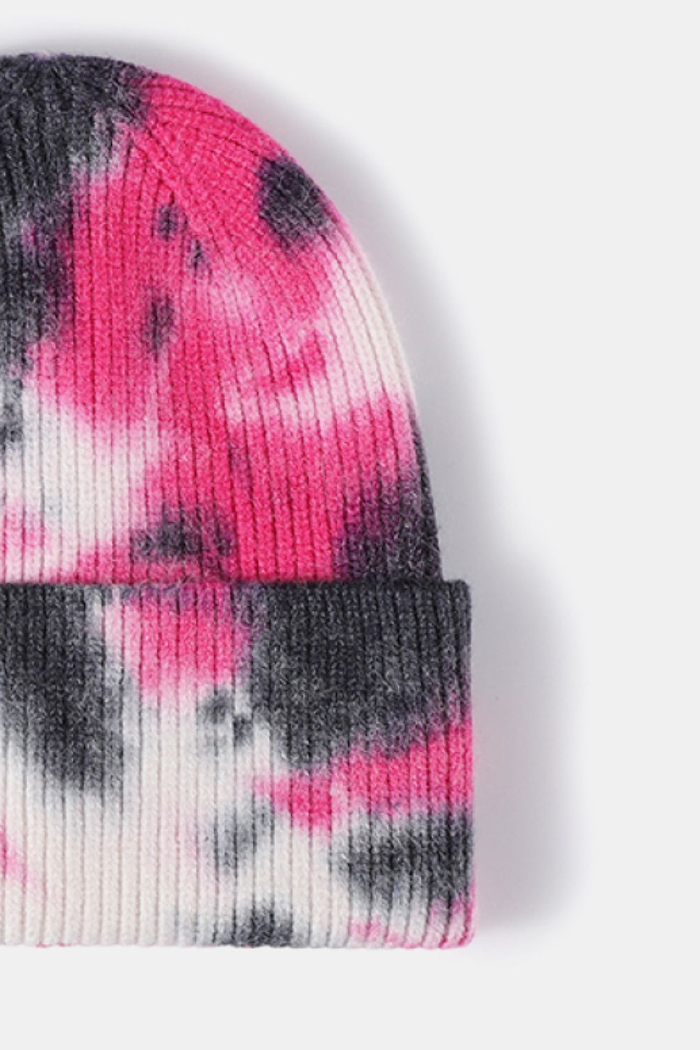Ribbed knit beanie with pink, gray, and white tie-dye pattern