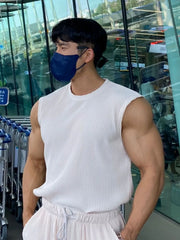 White ribbed sleeveless muscle tank top with a crew neck.