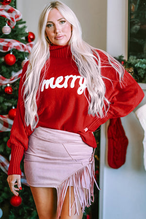 Red acrylic turtleneck sweater with white "merry" graphic and dolman sleeves.