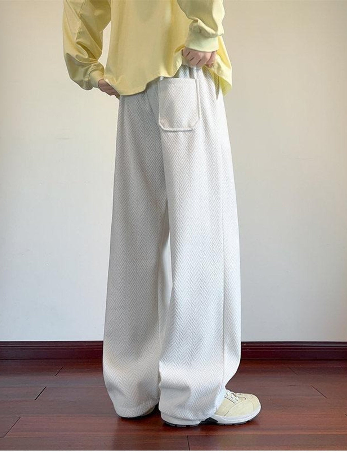 Men's white textured wide leg sweatpants with a single patch pocket.