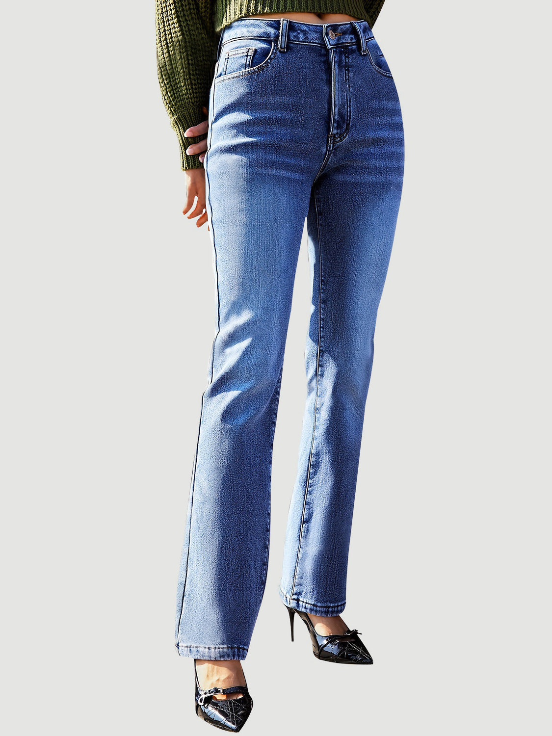 Medium wash cotton denim jeans with a subtle flare and modern silhouette.