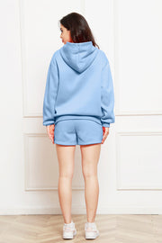 Light blue hooded loungewear set with shorts and a hoodie, shown from the back.