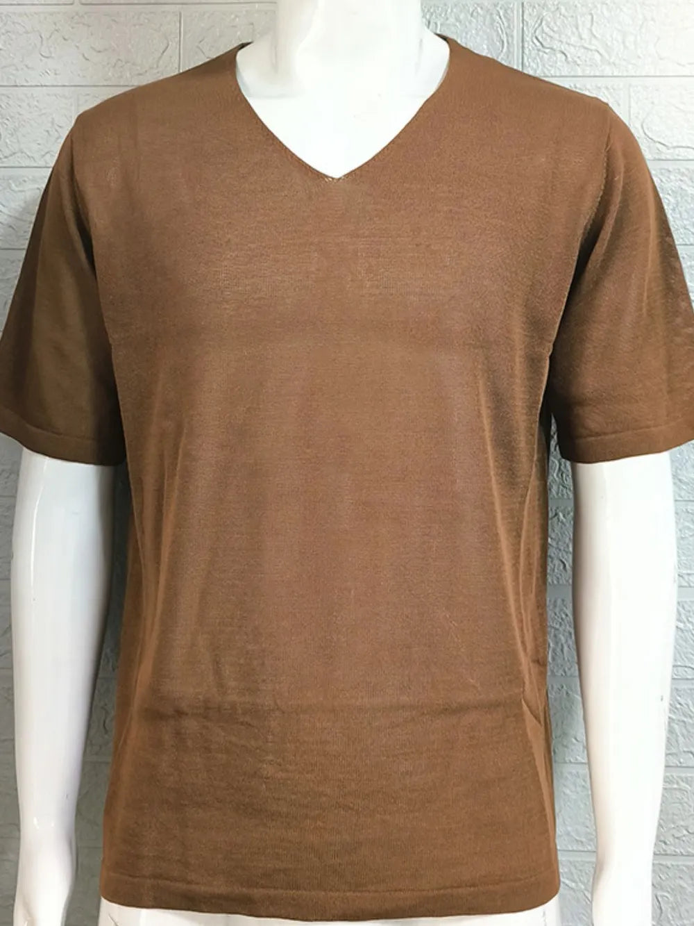 Brown textured knit tee with a subtle V-neck and short sleeves.