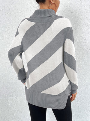 Gray and white diagonal stripe turtleneck knit sweater with a relaxed fit.
