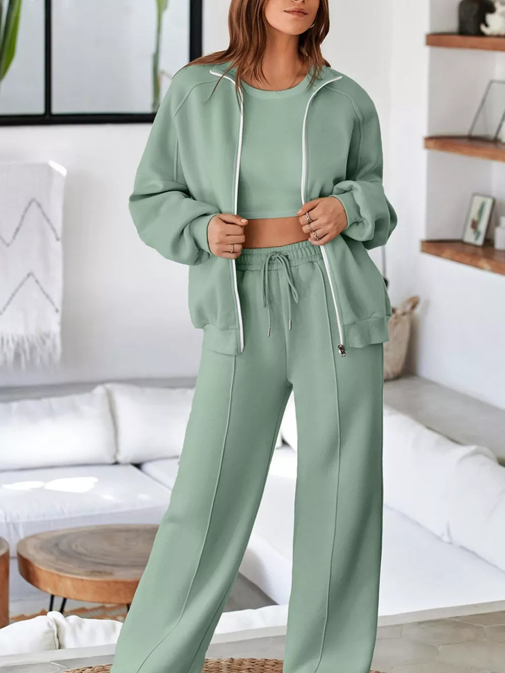 Sage cotton zip-up jacket and drawstring wide-leg pants set with white trim detail.