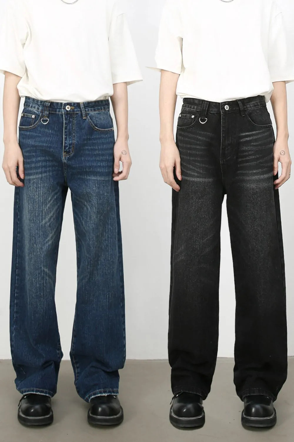 Wide leg distressed denim jeans in medium and dark washes with cat's whisker detail.