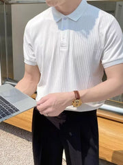White ribbed cotton polo shirt with button details and short sleeves.
