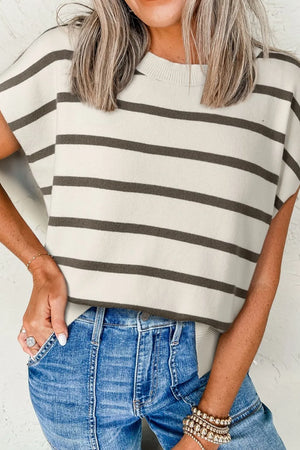 Striped knit cap-sleeve top with a crew neck and slit hem, styled with jeans.