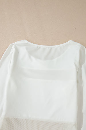 White long sleeve bodysuit with sheer mesh panel detail at the hem.