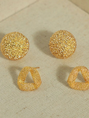 Textured gold cube earrings, round and triangular styles, with a sparkling finish.