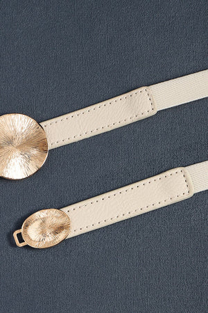 Ivory elastic belt with textured gold disc detail and faux leather trim.