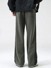 Men's army green sweatpants with black side stripes and a back pocket.