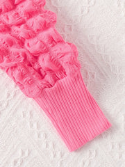 Pink baby dress with bubble texture and ribbed cuff