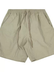 Men's sage lightweight drawstring shorts with elastic waist and side pockets.