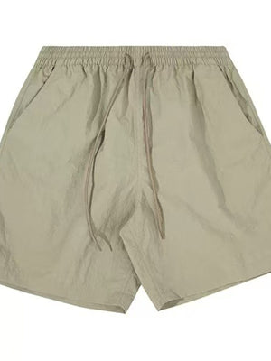Men's sage lightweight drawstring shorts with elastic waist and side pockets.