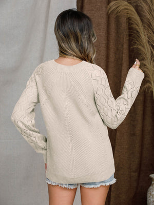 Diamond-cut raglan knit sweater in tan with diamond pattern on sleeves and chevron detail on back.