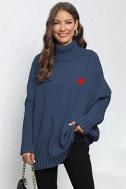 Dark Blue batwing knit turtleneck sweater with red heart embroidery and ribbed sleeves.