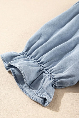 Light blue denim blouse with ruffled sleeve detail