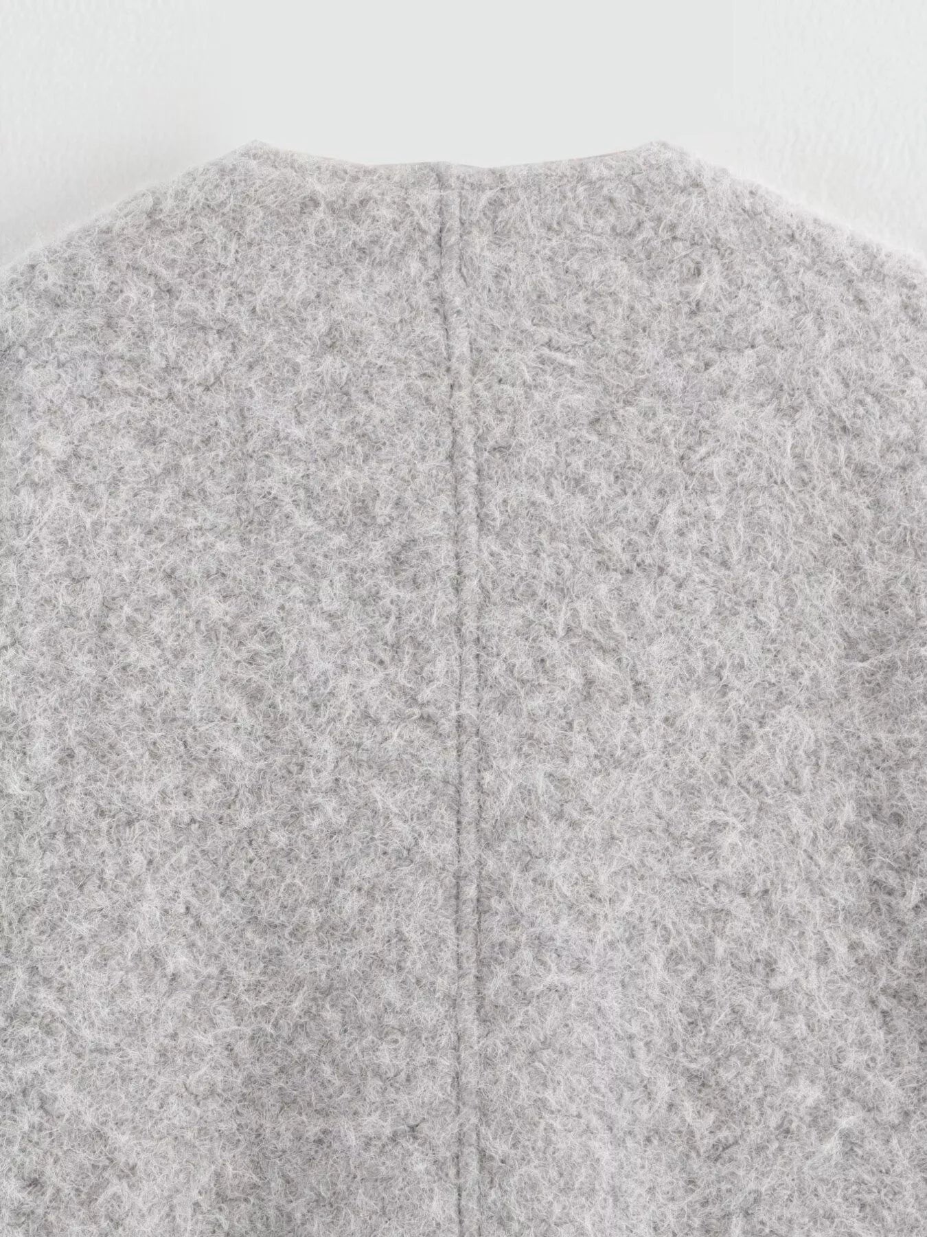 Textured knit tie-front coat in silver gray, showing back seam detail.