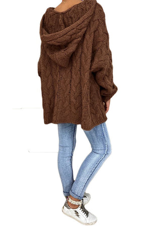 Brown cable knit hooded cocoon sweater with a relaxed fit.