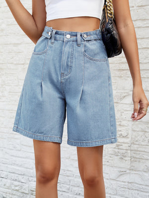 Light wash denim bermuda shorts with pleats and button closure.