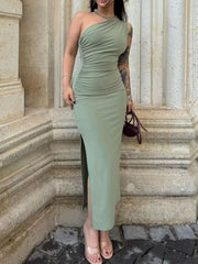 One-shoulder ruched bodycon dress in green with a thigh-high slit.