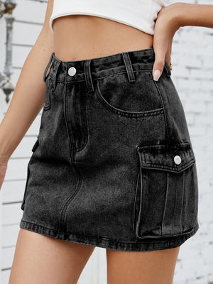 Black denim cargo mini skirt with button flap pockets.