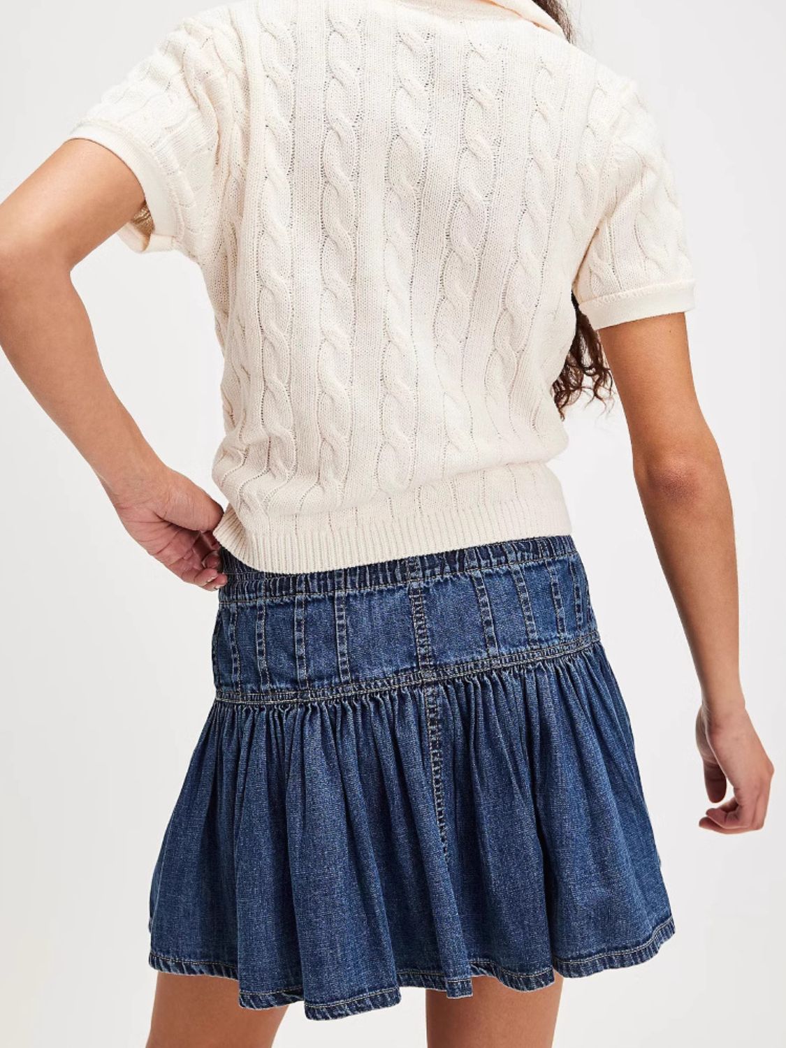 Denim ruffle mini skirt in light blue with smocked waist detail