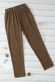 Mocha corduroy drawstring trousers with slant pockets and a relaxed fit.